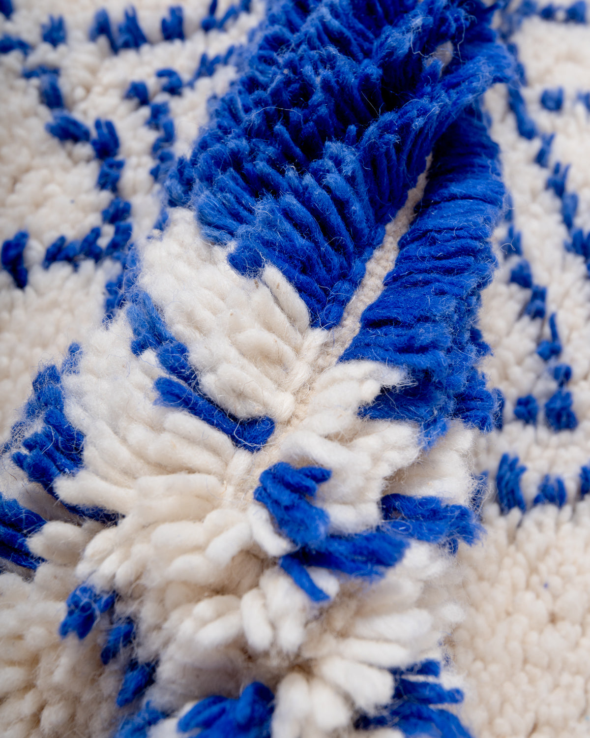 Modern, designer, handcrafted Berber rug from Morocco. Beniourain carpet with beautiful colours and patterns and fluffy wool texture.